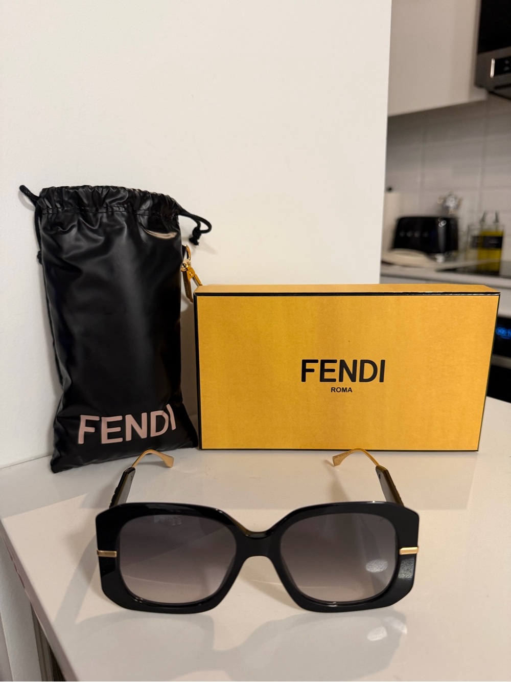 Fendi Black Sunglasses with Gold Temple Accents